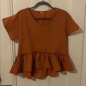 Burnt orange peplum top